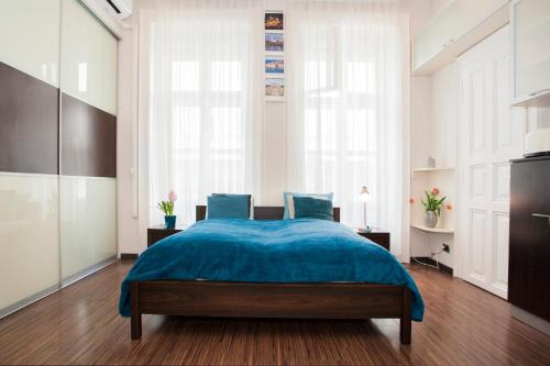 Postel nebo postele na pokoji v ubytování Viktoria Central Apartment