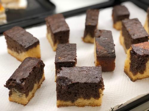 a bunch of brownies sitting on a baking sheet at Hotel Perla in Benidorm