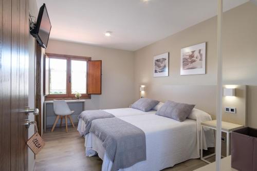 Postel nebo postele na pokoji v ubytování Casa O Real