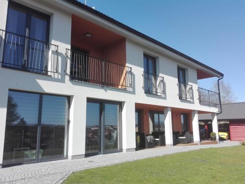 a building with windows and balconies on it at Penzion Na Svahu in Cheb