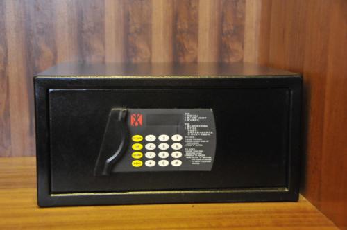 a microwave with a remote control inside of it at Urban Alley Hotel in Hanoi