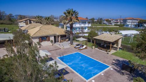 an aerial view of a house with a swimming pool at Iguana Villa in Kalamaki
