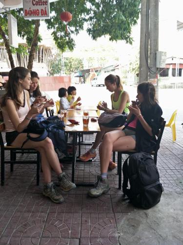 a group of women sitting at a table at Ngan Ha Homestay in Ha Giang