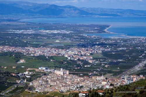 an aerial view of a city and a body of water at B&B Altamarea in Marina di Schiavonea
