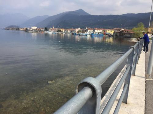 a man standing on a bridge over a body of water at B & B Da Giusy in Corte Franca