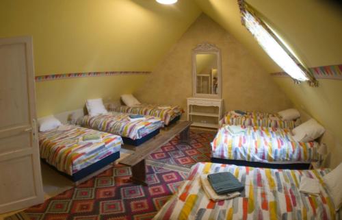 Una cama o camas en una habitación de Gîte des Demoiselles