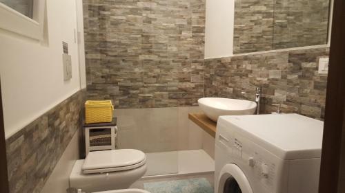 a bathroom with a toilet and a sink at Casa vacanza Luisa in Trieste