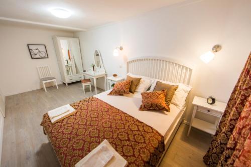 a bedroom with a large bed in a room at Apartments Ivica in Split