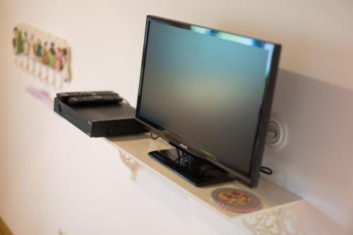 a computer monitor sitting on top of a desk at Krk Houses in Kornić