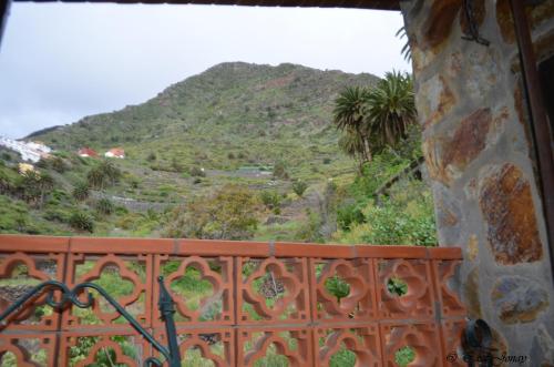 a view of a mountain from a balcony at Casa Jonay in Hermigua