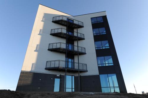 a building with balconies on the side of it at Tananger Apartment Hotel in Tananger