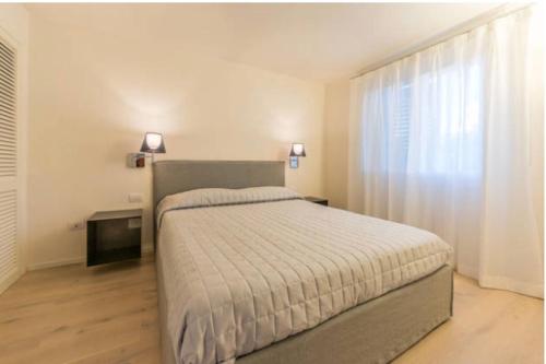Ένα ή περισσότερα κρεβάτια σε δωμάτιο στο Appartamento Il Principe