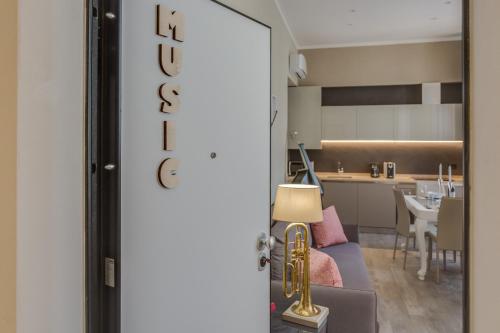 a view of a living room and kitchen from a door at Cherubini Palace Thematic Apartment in Florence