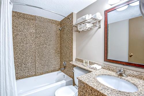 A bathroom at red maple inn and suites