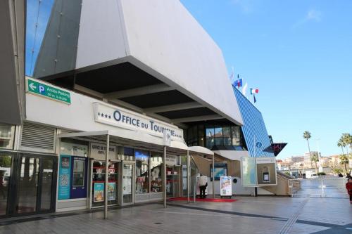 a building with a sign on the side of it at RIVIERA STUDIO CANNES CENTER in Cannes