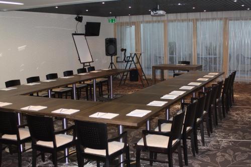 a large conference room with a long table and chairs at Hotel Babilonas in Kaunas