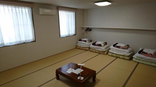 Postel nebo postele na pokoji v ubytování Hotel Taiheiyo