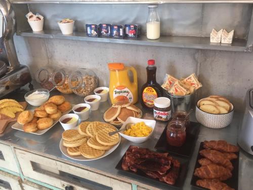 a counter with a bunch of different types of food at Pove 2.4 Hotel in Pove del Grappa