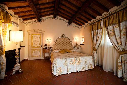 En eller flere senge i et værelse på Relais La Corte dei Papi