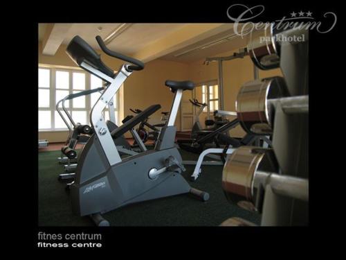 a gym with several exercise bikes and a treadmill at Parkhotel Centrum in Spišská Nová Ves