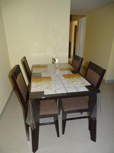 a dining room table with chairs and a table cloth at Casale Majorda in Majorda