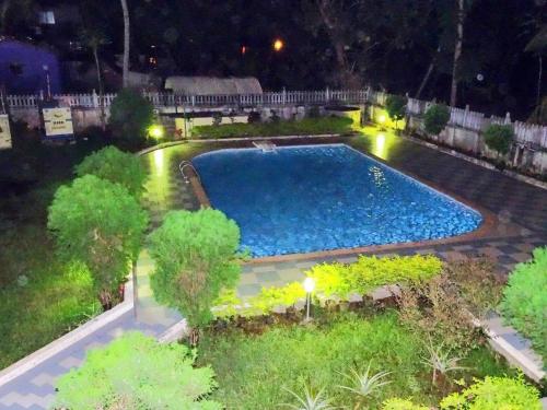 an overhead view of a swimming pool at night at Casale Majorda in Majorda