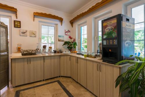 Kuchyň nebo kuchyňský kout v ubytování Calypso Cozy Suites