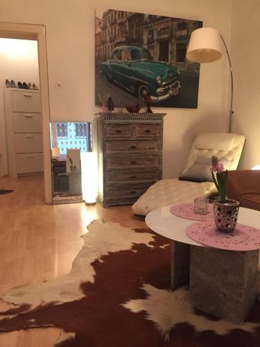 a bedroom with a table and a green car on the wall at BS Business Travelling Hannover City in Hannover
