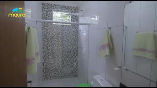 Ett badrum på Condomínio Maura
