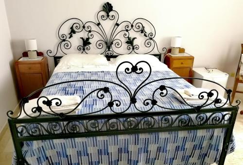 Cama ou camas em um quarto em B&B Faro Bianco