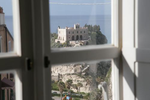 a view of a castle from a window at Lo Splendore del Borgo in Tropea
