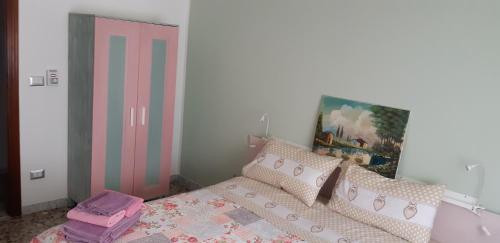 Ein Bett oder Betten in einem Zimmer der Unterkunft Alloggio Ugo Foscolo