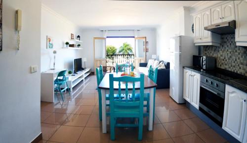 a kitchen and dining room with a table and chairs at Summer Breeze in Puerto de la Cruz