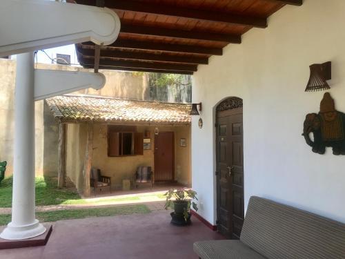 an outside view of a house with a door at Hotel La Felicita in Mirissa
