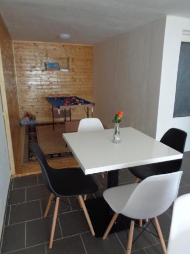 a dining room with a ping pong table and chairs at Penzion U Ježů - Ubytování in Pasohlávky