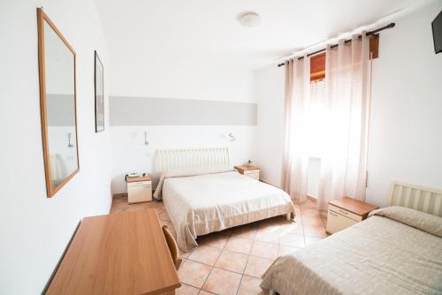 Postel nebo postele na pokoji v ubytování Hotel da Renato