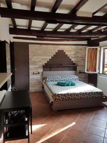 a bedroom with a large bed in a room at La Soffitta in Bologna
