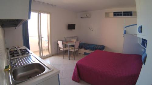 Kuchyň nebo kuchyňský kout v ubytování Athena b&b Castro