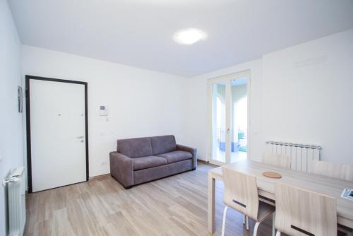 a living room with a table and a couch at Santa Caterina in Levanto