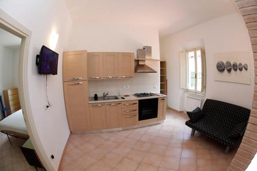 a kitchen with a sink and a stove at Villa La Pila Bilo in Marina di Campo