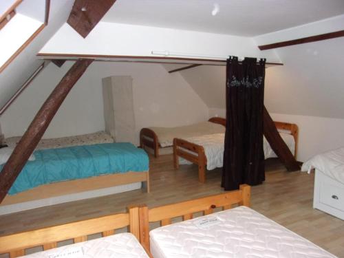Säng eller sängar i ett rum på Gîte à la campagne