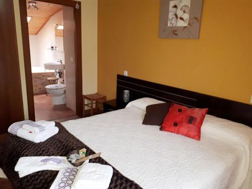 Llit o llits en una habitació de Hotel Rural La Robla
