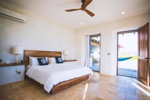 Cama o camas de una habitación en Villa Nomada