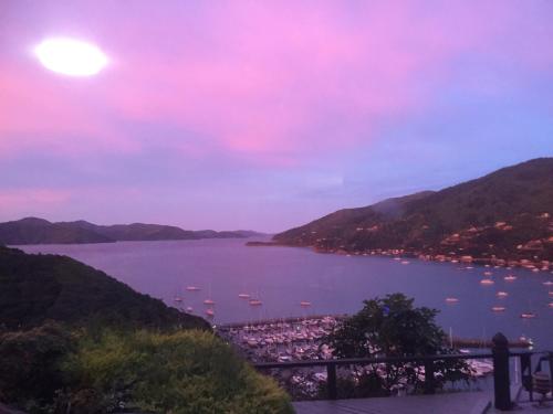 a view of the bay at sunset at Dons Place in Waikawa