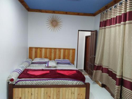 Katil atau katil-katil dalam bilik di HOMESTAY Kb Wakaf Kayu