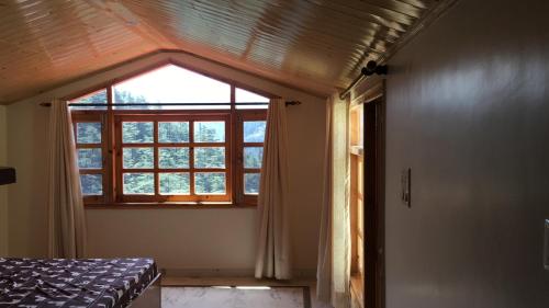 Postel nebo postele na pokoji v ubytování Vipul Home Stay