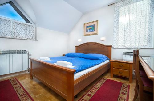 Postel nebo postele na pokoji v ubytování Guesthouse Janez