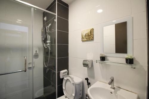 a bathroom with a shower and a toilet and a sink at H2H - Euro House @ Majestic Ipoh (8~10 Guests) in Ipoh