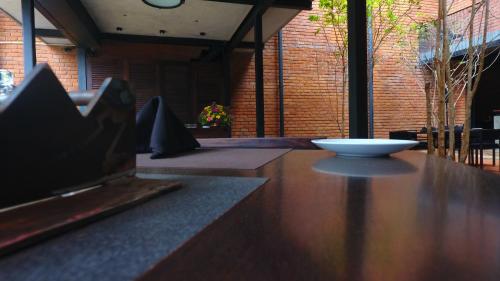 a wooden counter with a bowl on top of it at BBQ HUB Ella in Ella