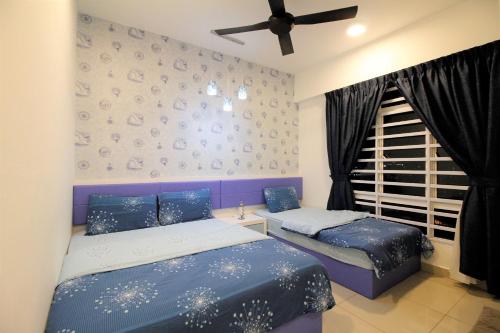 a bedroom with two beds and a window at H2H - Marine Home @ Majestic Ipoh (8~10 Guests) in Ipoh